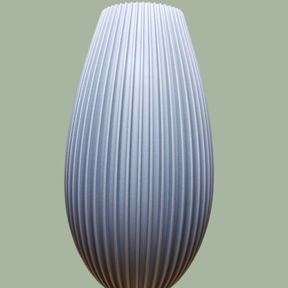 3D printed teardrop style vase with ribbed detail in a grey concrete colour