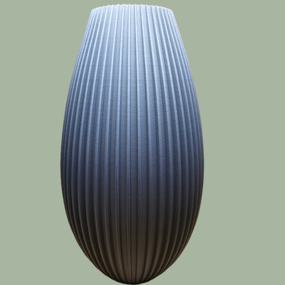 3D printed teardrop style vase with ribbed detail in a grey concrete colour