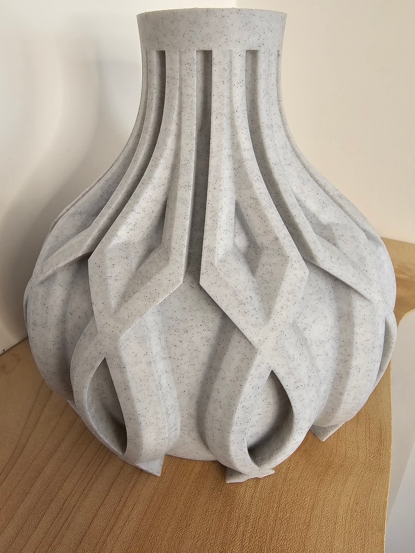 3D printed vase with raised detail in a stone filament