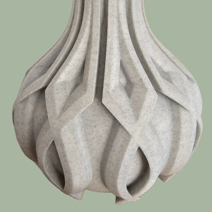 3D printed vase with raised detail in a stone filament