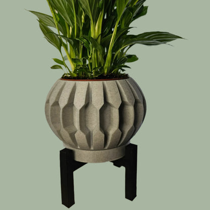 3D printed planter with raised detail, including drainage tray and black stand