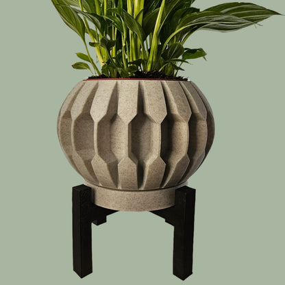 3D printed planter with raised detail, including drainage tray and black stand