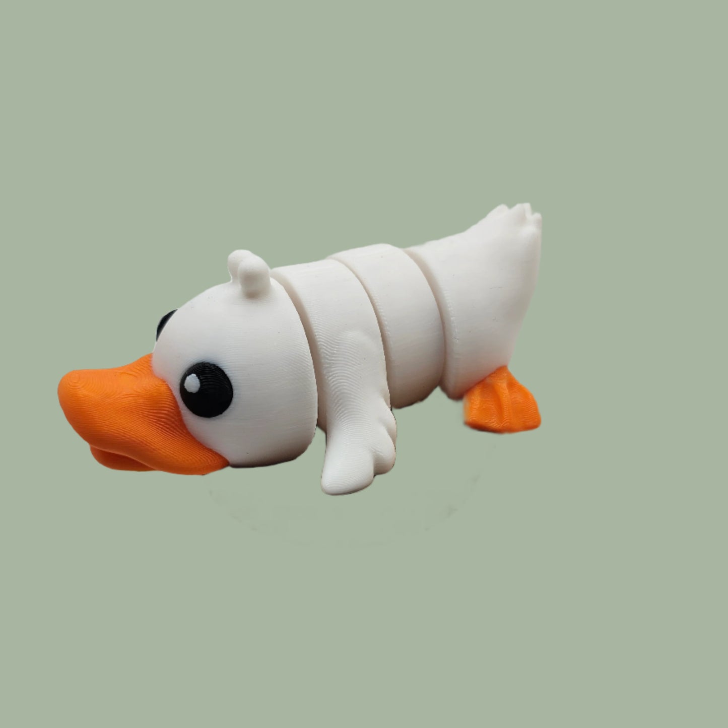 3D printed white and orange duck articulated desk buddy