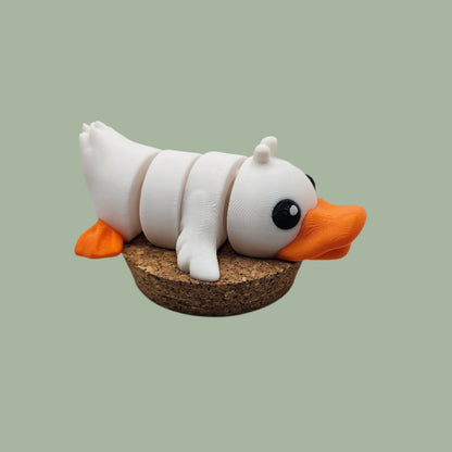 3D printed white, orange and black duck articulated desk buddy