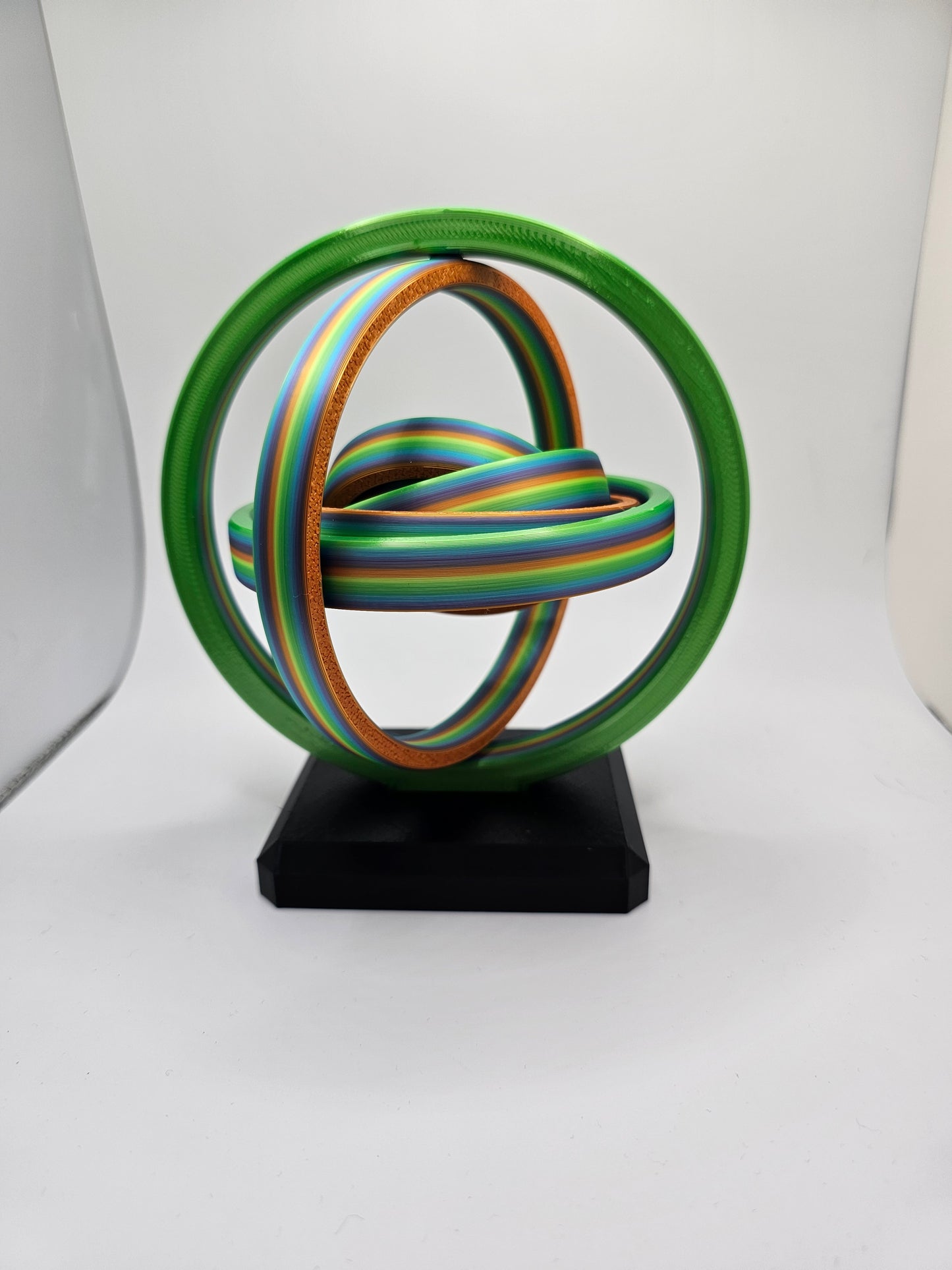 3D printed gyroscopic kinetic art on a black base