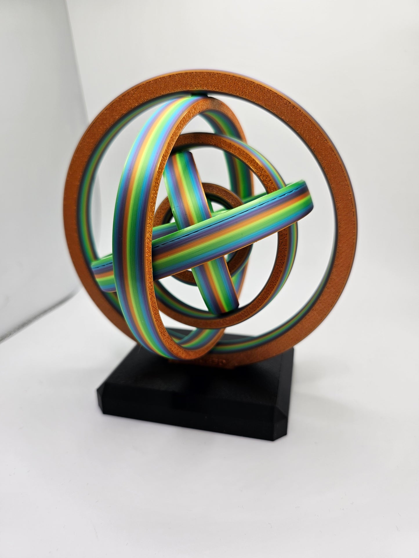 3D printed gyroscopic kinetic art on a black base