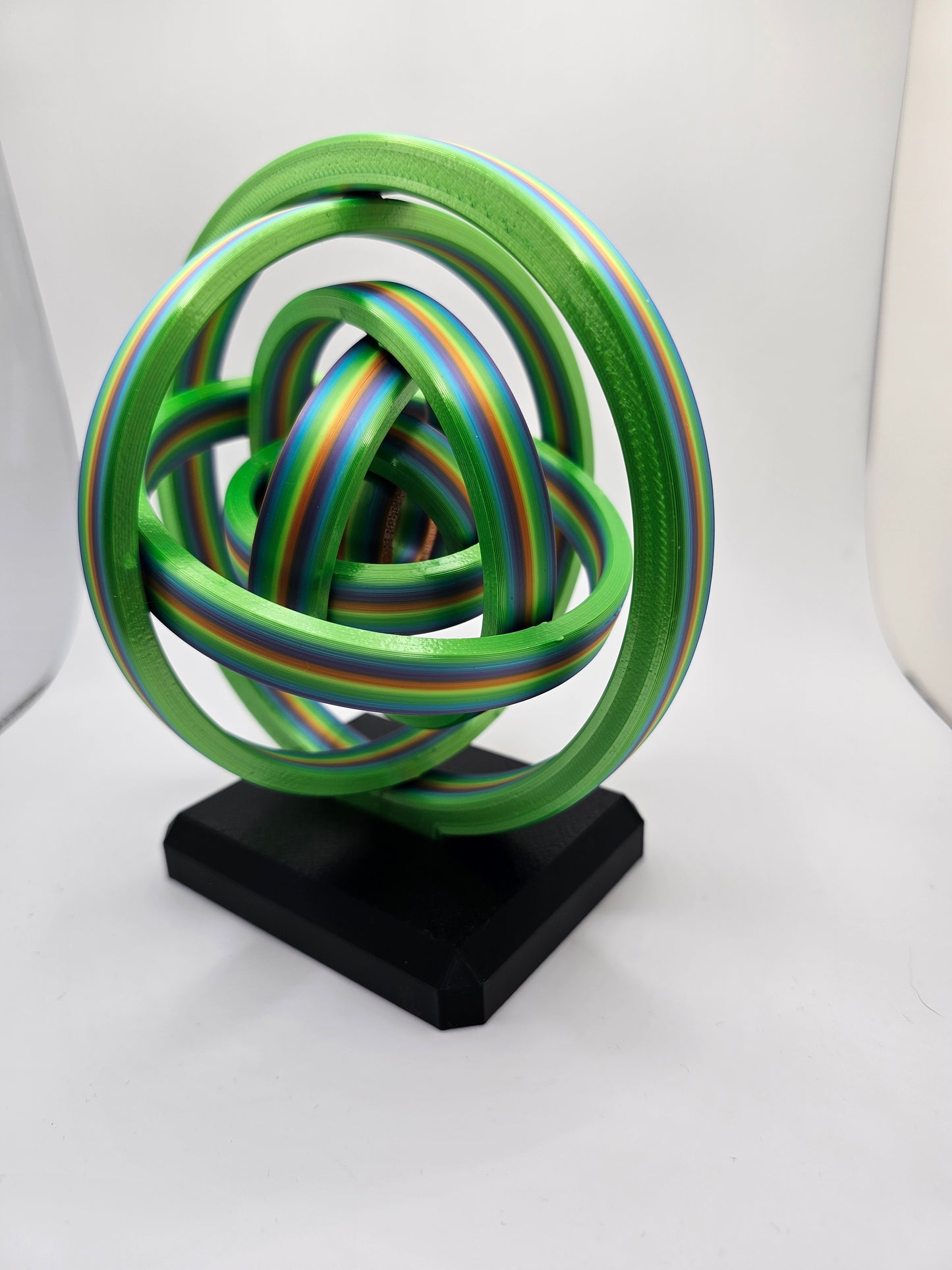 3D printed gyroscopic kinetic art on a black base