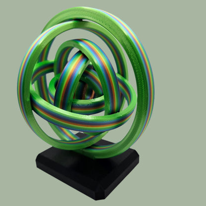 3D printed gyroscopic kinetic art on a black base