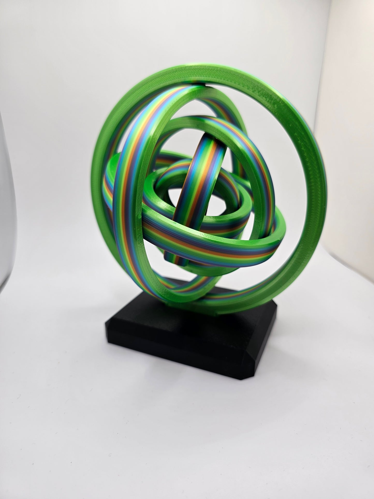 3D printed gyroscopic kinetic art on a black base