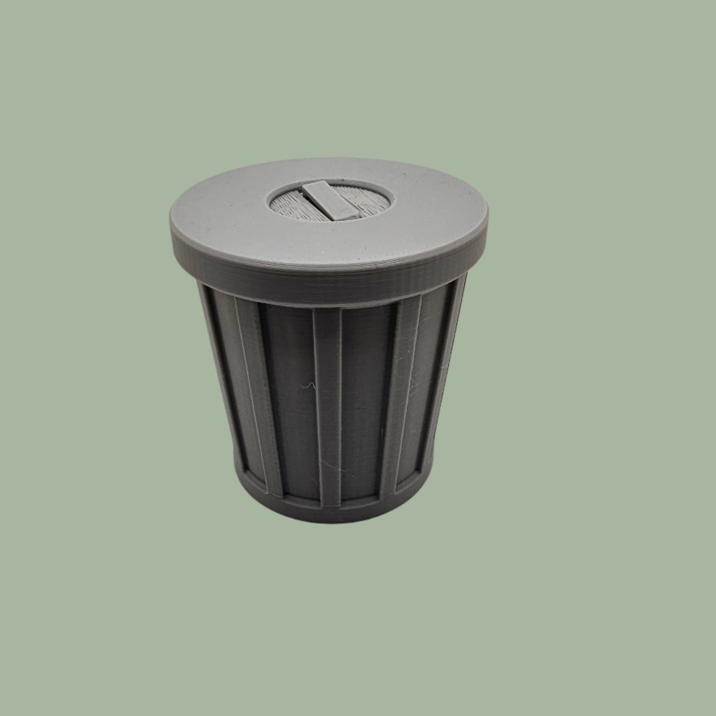 3D printed trash can containing flexi animal