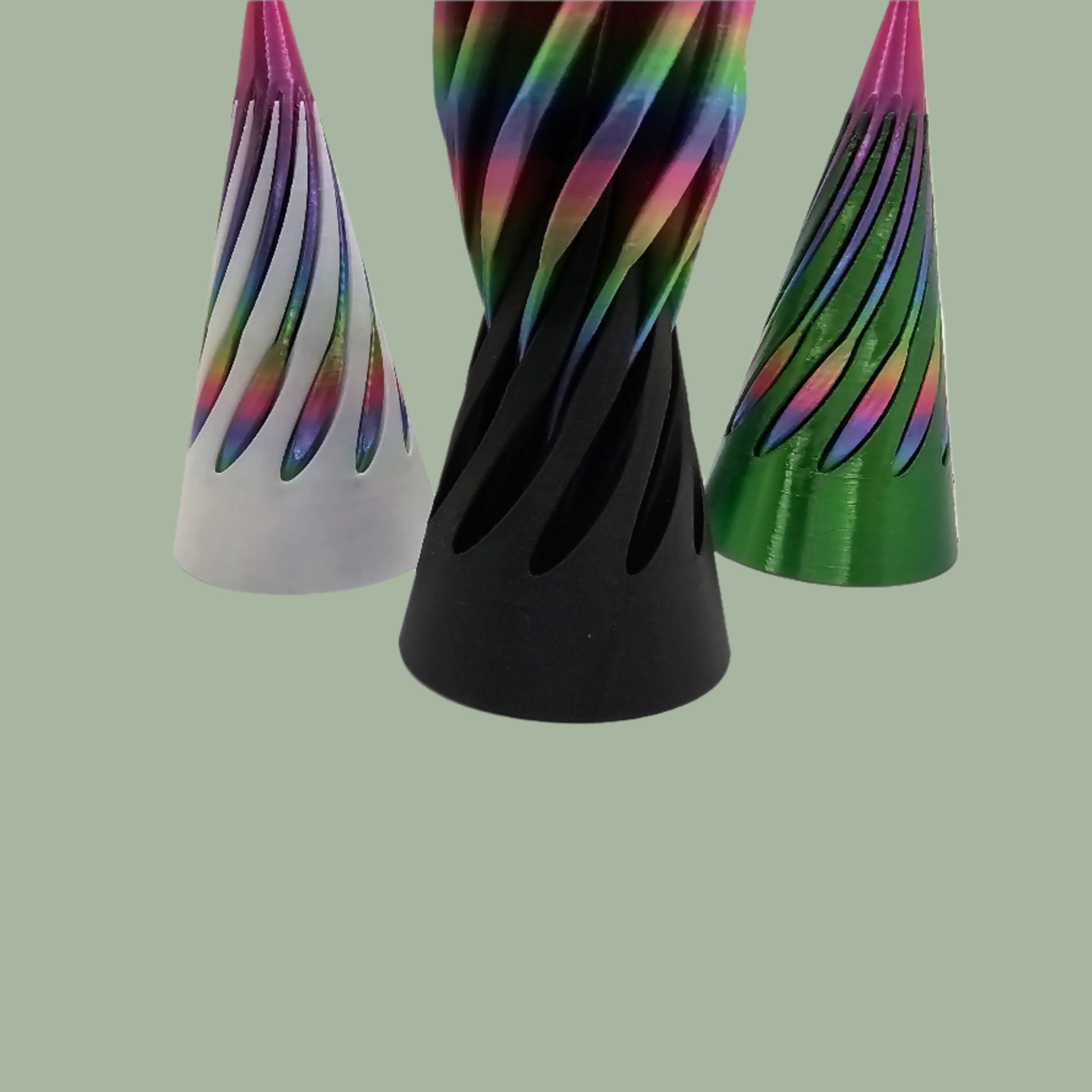 vibrant 3D-printed Infinity Cones V2, each featuring a sleek spiral cut design. The cones are in a random colour, including white, green, black, and rainbow gradients. Designed for smooth sliding and fidgeting, these eye-catching desk toys are handmade in the UK