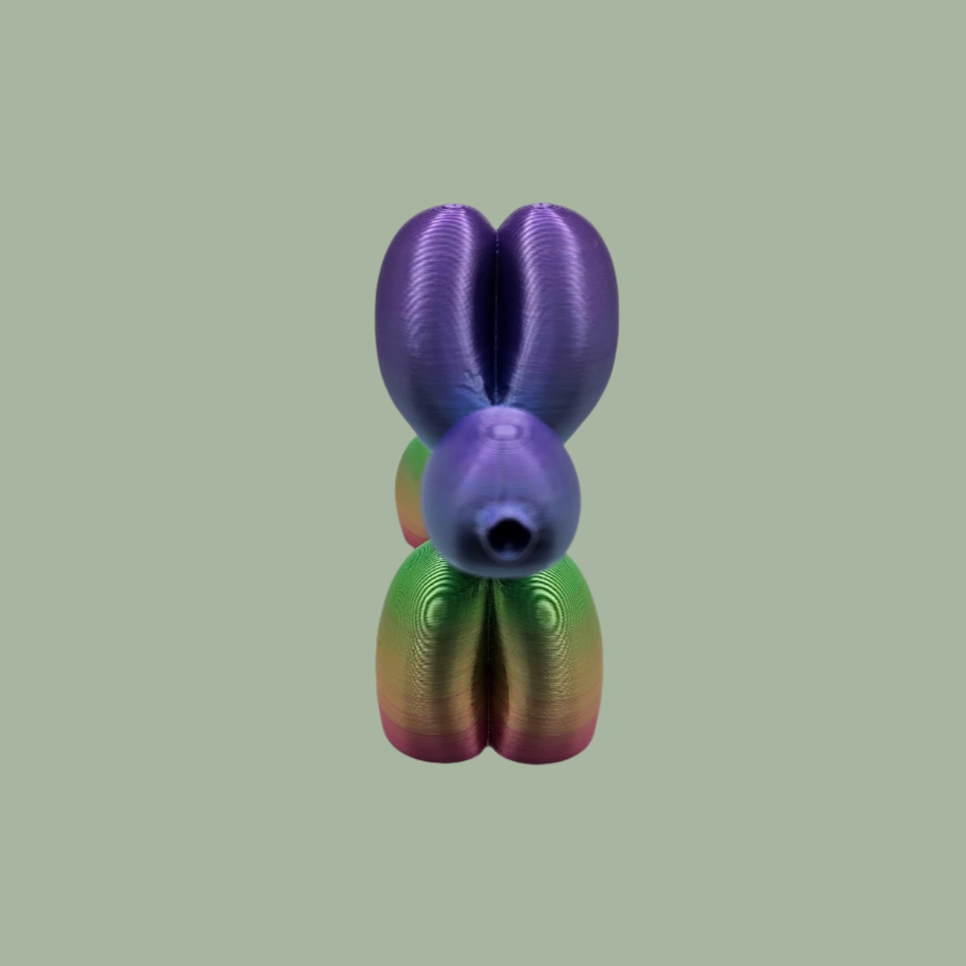 Unique rainbow balloon dog figurine, 3D printed with a smooth, glossy finish. A colourful and fun sculpture for home or office decor