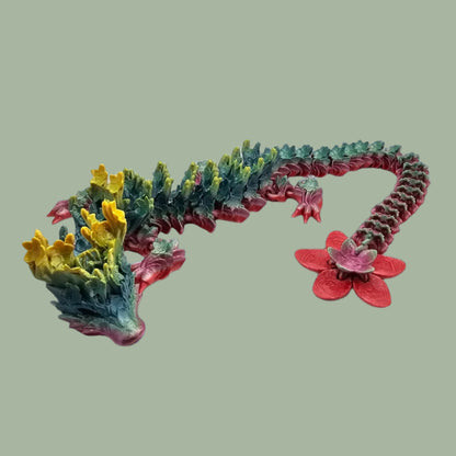 3D printed articulated dragon with cherry blossom details along the body and a flexi flower on the tail