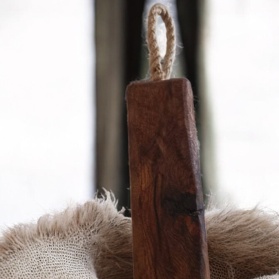 Solid wood doorstop with rustic rope handle