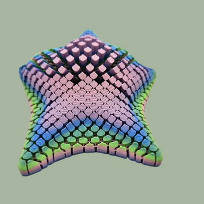 3D printed mesh articulated starfish with black eyes in a pastel rainbow colour