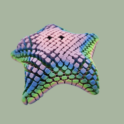 3D printed mesh articulated starfish with black eyes in a pastel rainbow colour