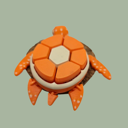 3D printed fruit turtle clicker, with 7 buttons, flexi flippers, in the style of an orange