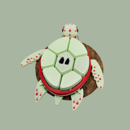 3D printed fruit turtle clicker, with 7 buttons, flexi flippers, in the style of an apple