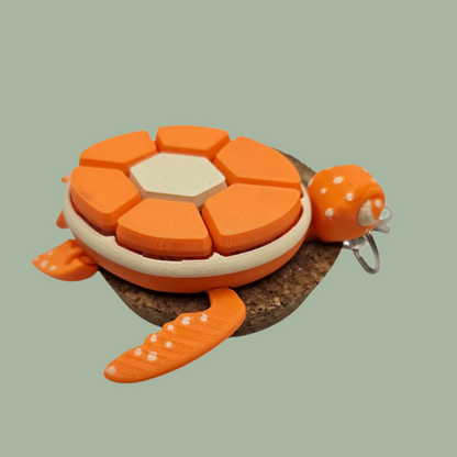 3D printed fruit turtle clicker, with 7 buttons, flexi flippers, in the style of an orange