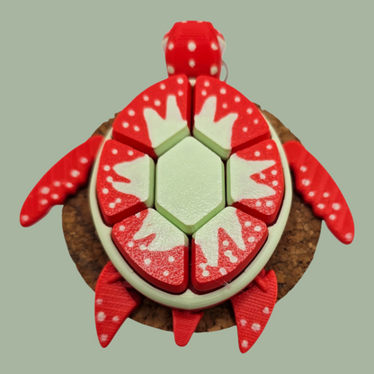 3D printed fruit turtle clicker, with 7 buttons, flexi flippers, in the style of a strawberry