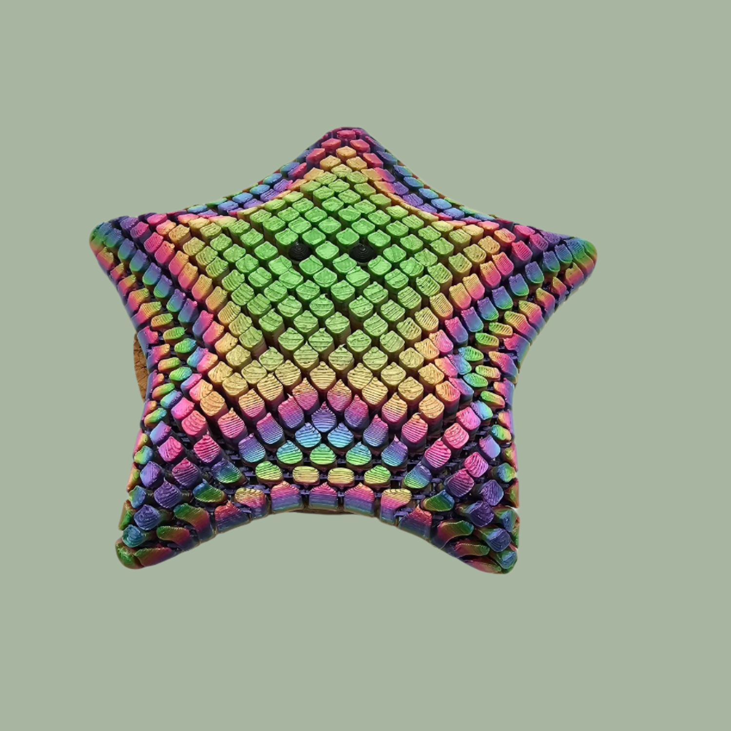 3D printed mesh articulated starfish with black eyes in a candy rainbow colour