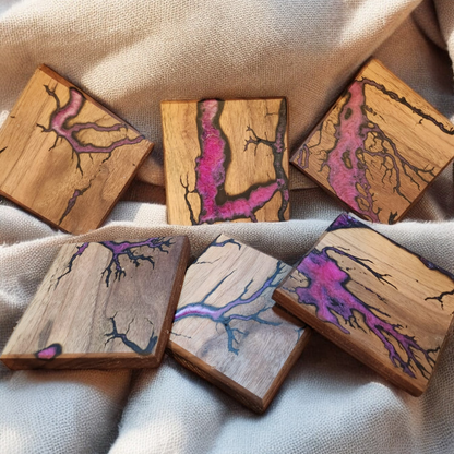 Solid wood coasters with electrocuted detail infilled in resin in a choice of colours