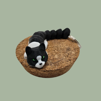 Black and white articulated cat keyring